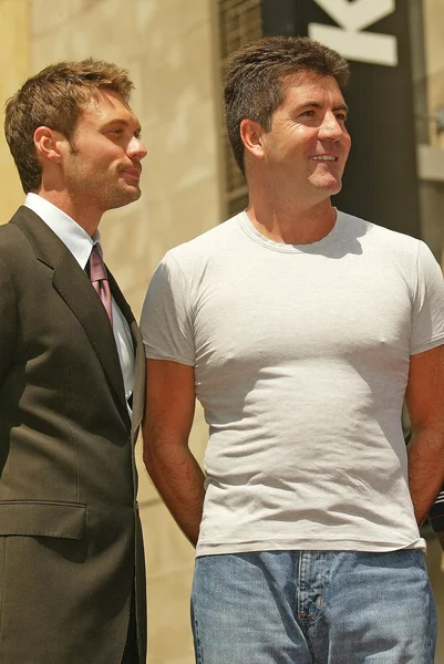 Ryan Seacrest y Simon Cowell — Foto de Stock