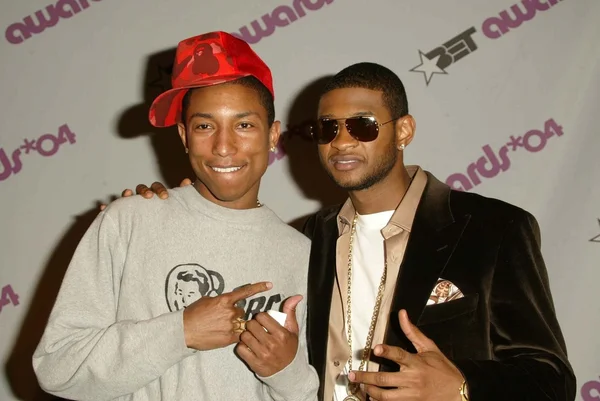 Pharrell williams en usher — Stockfoto