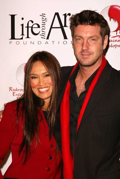 Tia carrere och simon wakelin — Stockfoto