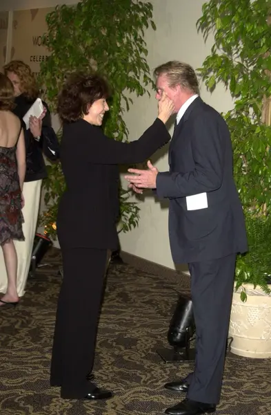 Lily tomlin och gary busey — Stockfoto