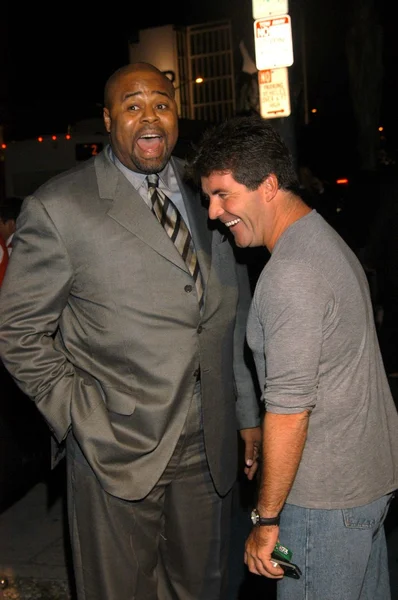 Chi mcbride en simon cowell — Stockfoto