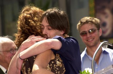 Susan Sarandon hugs Kieran Culkin as Ryan Phillippe looks on at Sarandon's Star clipart