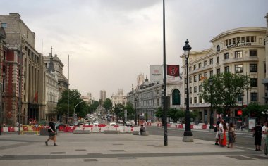   Madrid, Spain - June 13, 2022: Madrid streets with buildings and people, Madrid street photography                             