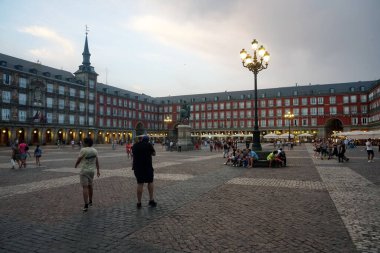 Madrid, Spain - June 13, 2022: Plaza Mayor square in Madrid in a beautiful summer evning                               