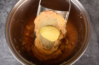 Potato on a metal potato grater, Grated potatoes
