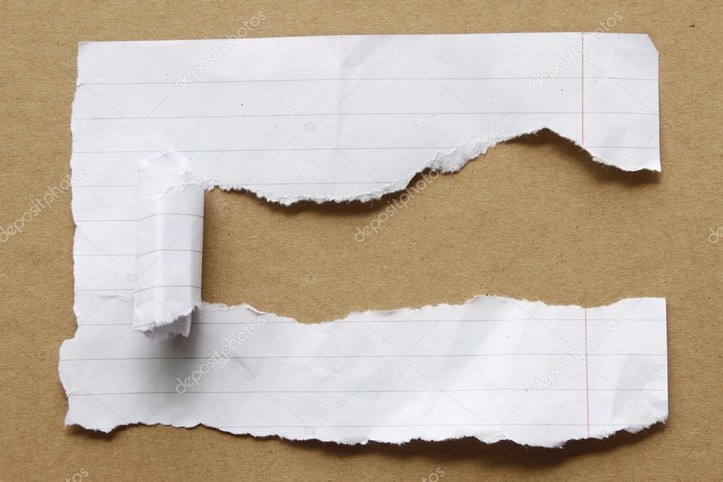 Ripped paper on brown background