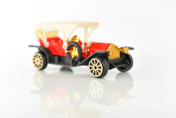 Plastic model of retro cars on white background with reflection. — Stock Photo, Image