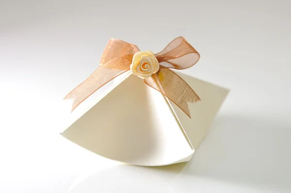Small gift in a decorative paper packaging. Stock Image
