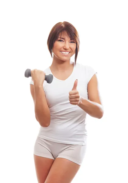 Egzersiz yaparken genç ve zinde esmer beyaz kadın — Stok fotoğraf