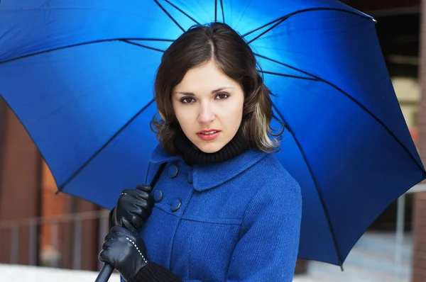 Fashion shoot of young attractive woman with umbrella — Stock Photo, Image