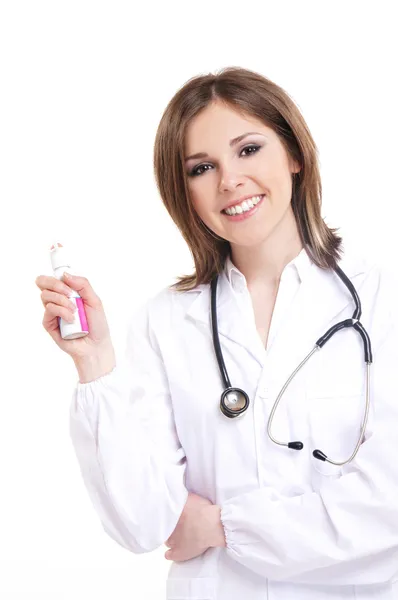 Young and attractive doctor with a throat spray isolated on white — Stock Photo, Image