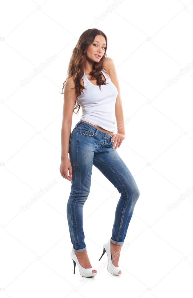 Young, fit and sexy woman in jeans and white top
