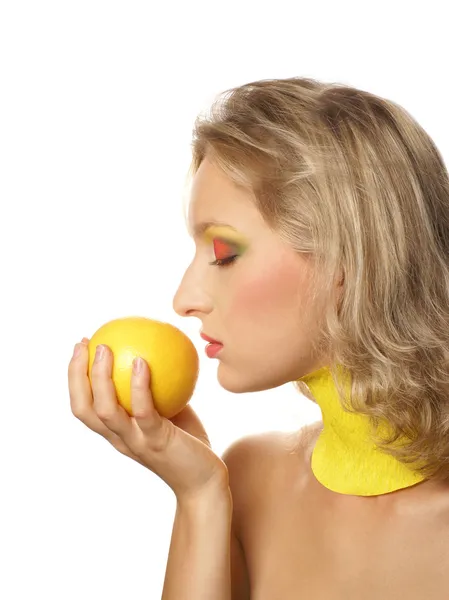 Young beautiful woman eating grapefruit — Stock Photo, Image