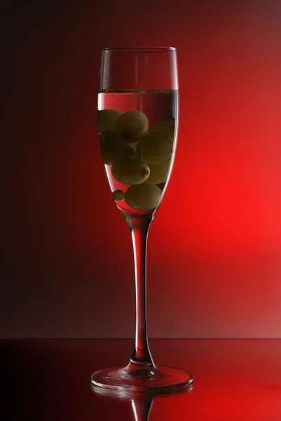 Druif in glas wijn Stockafbeelding