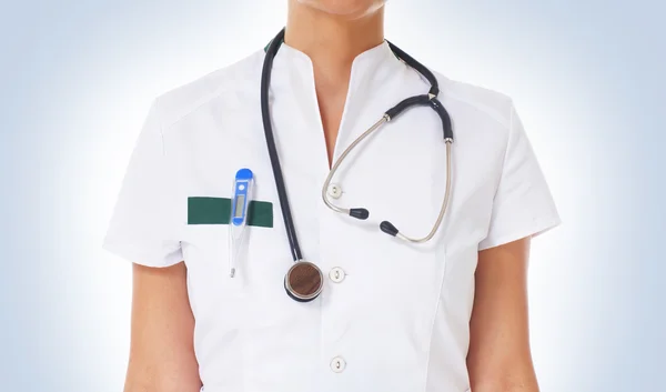 Young attractive doctor over blue background — Stock Photo, Image