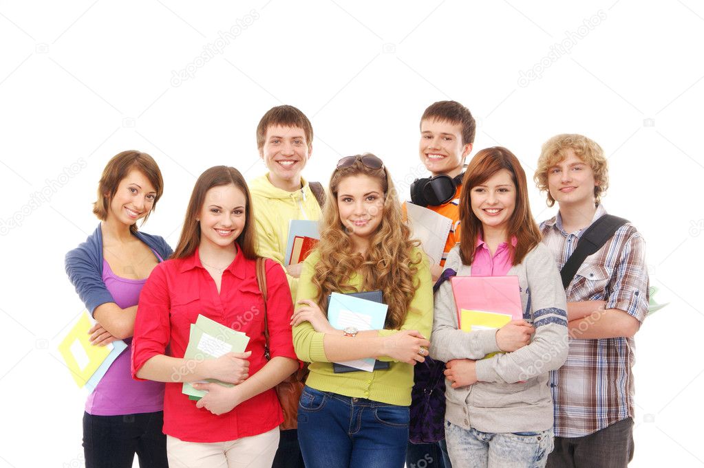 Group of smiling teenagers staying together