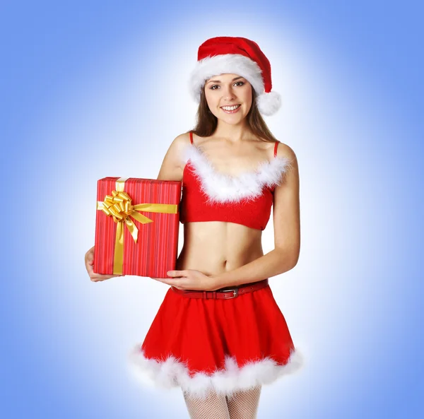 Sexy santa over blauwe achtergrond — Stockfoto