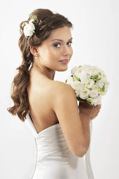 Young attractive bride with the bouquet of white roses — Stock Photo, Image