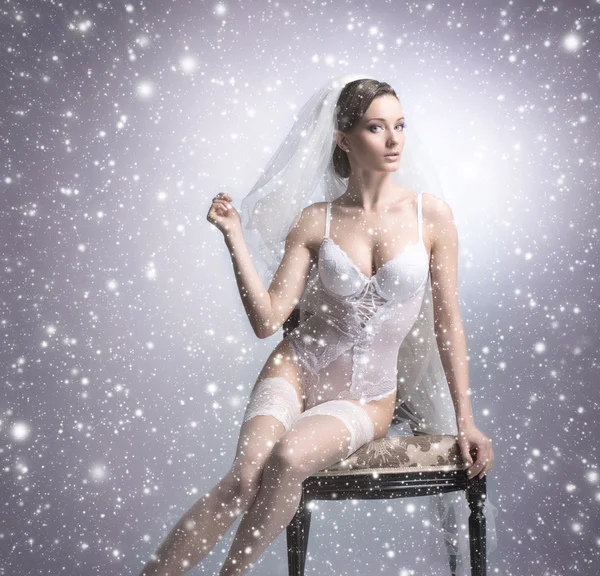 Young sexy bride in erotic lingerie over Christmas background — Stock Photo, Image