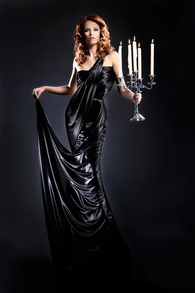 Fashion shoot of beautiful woman in a long dress — Stock Photo, Image