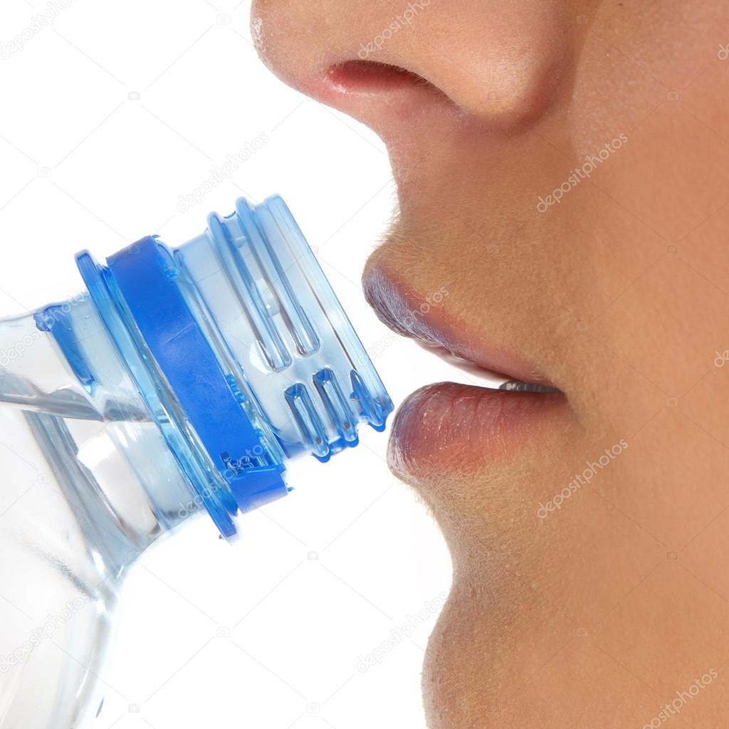 Close up picture of mouth and bottle