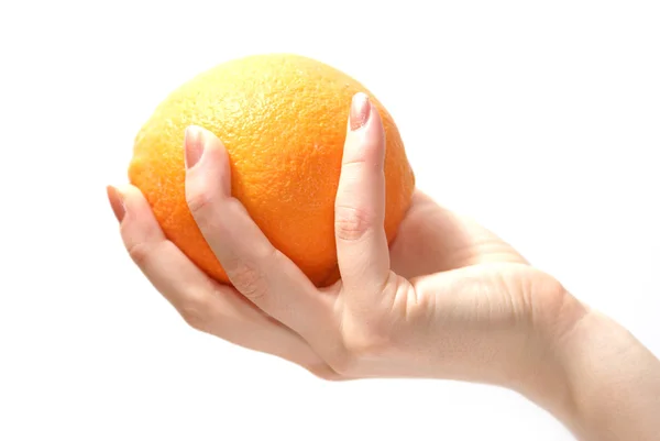 Оранжевый в руках — стоковое фото