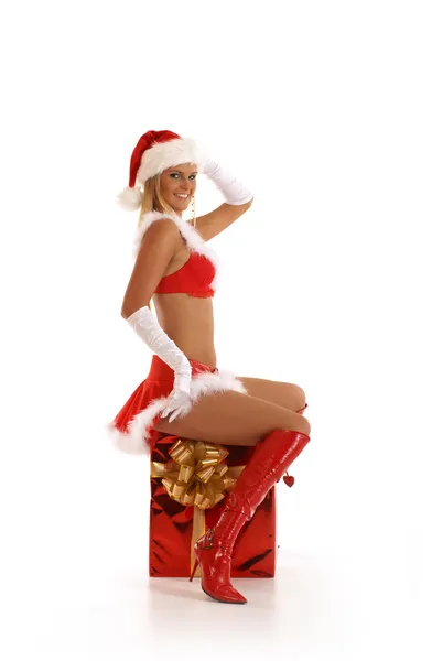 Büyük bir hediye beyaz izole oturan genç seksi Noel Baba — Stok fotoğraf