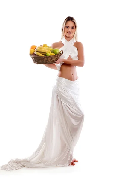 Attractive woman with a basket full of fruits — Stock Photo, Image