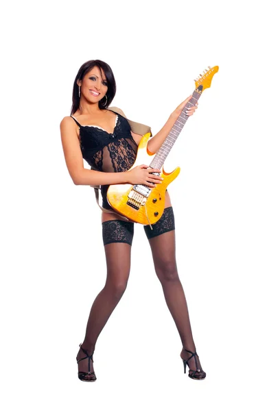 Sexy female guitar player in fetish lingerie isolated on white — Stock Photo, Image