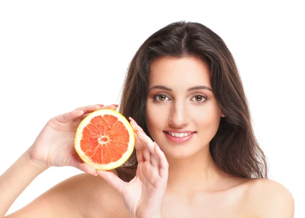 Portrait of young and sexy brunette with an exotic fruit — Stock Photo, Image