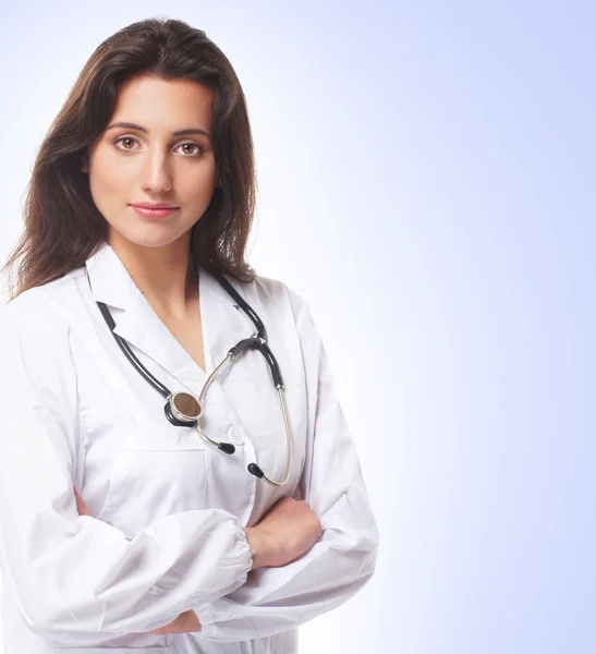 Young attractive female doctor isolated over white background — Stock Photo, Image