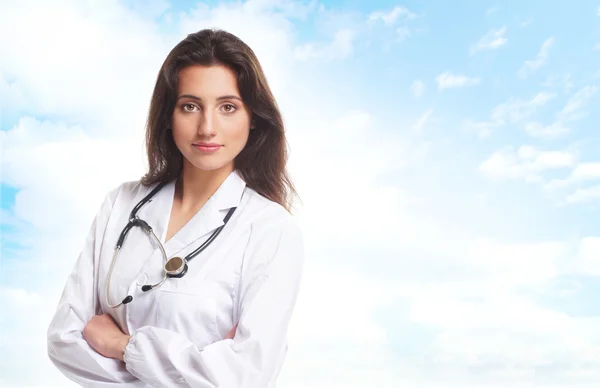 Young attractive female doctor isolated over white background — Stock Photo, Image