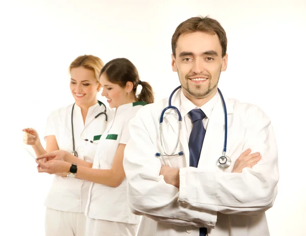 Team of young and smart medical workers isolated on white — Stock Photo, Image