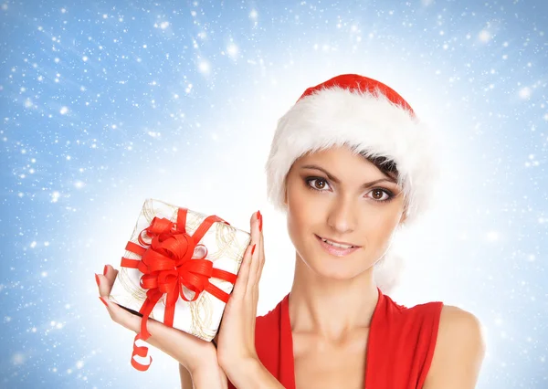 Portrait of young, sexy female Santa isolated on blue — Stok fotoğraf