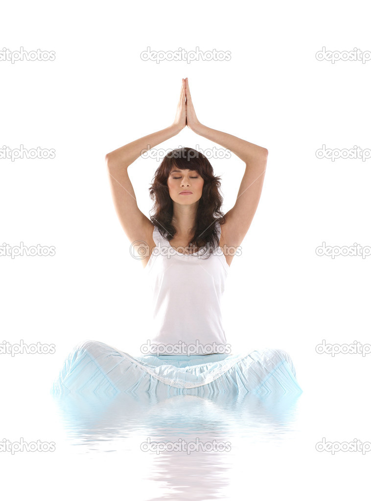Young fit brunette meditating