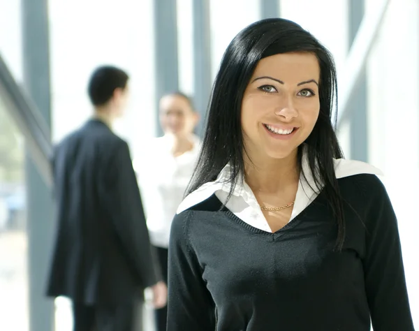 Attractive business woman and her team — Stock Photo, Image