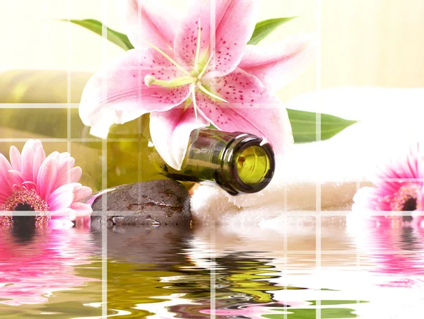 Bottle of massaging oil over spa background — Stock Photo, Image