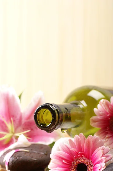 Bottle of massaging oil over spa background — Stock Photo, Image