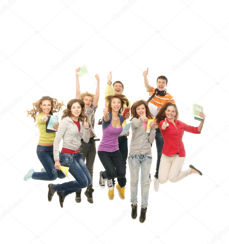 Group of smiling teenagers jumping together and looking at camera