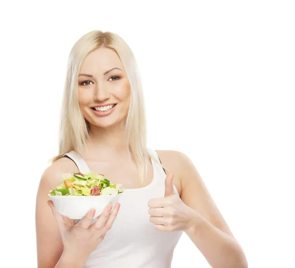 Young attractive girl with fresh and tasty salad Stock Image