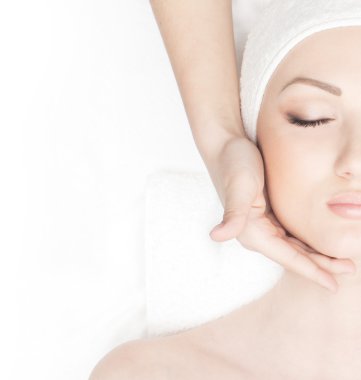 Young beautiful lady getting spa treatment clipart