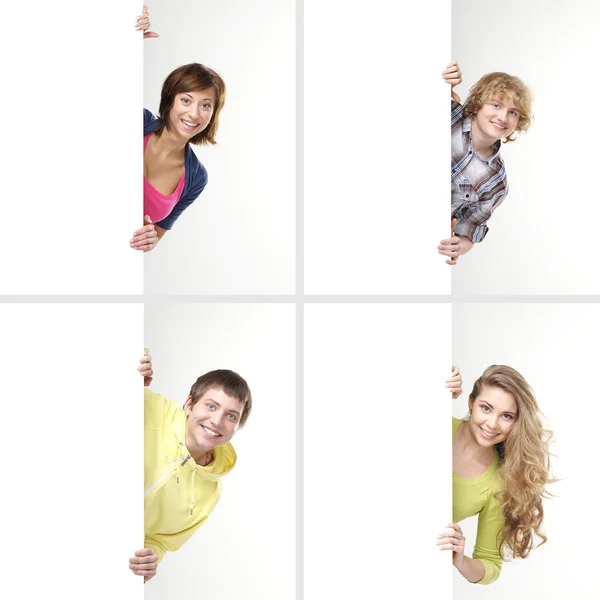 Set of teenagers with a giant, blank — Stock Photo, Image