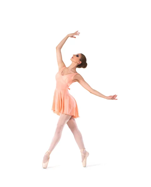 A young ballet dancer in a light dress on a white background — Stock Photo, Image