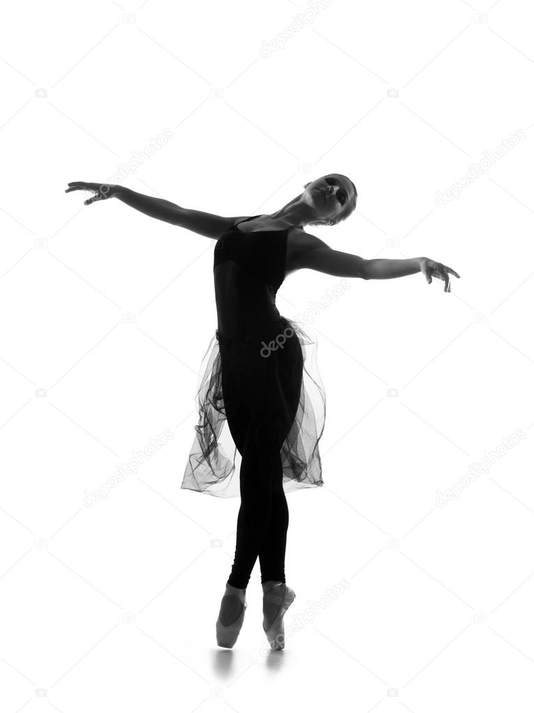 A young ballet dancer in a dress on a white background