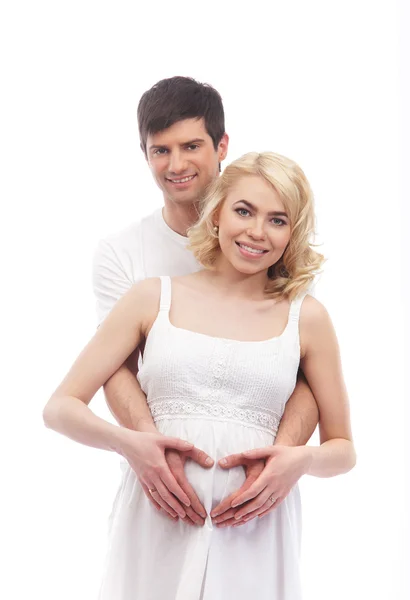 Un couple heureux : mère enceinte et père sur blanc — Photo