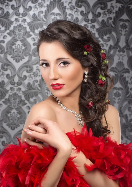 Cabaret artist in red boa over the vintage background — Stock Photo, Image