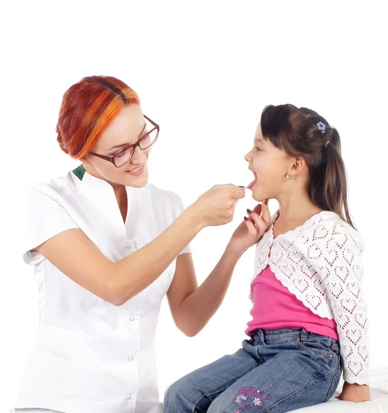 A young girl on a dentist procedure on a white background — Stock Photo, Image