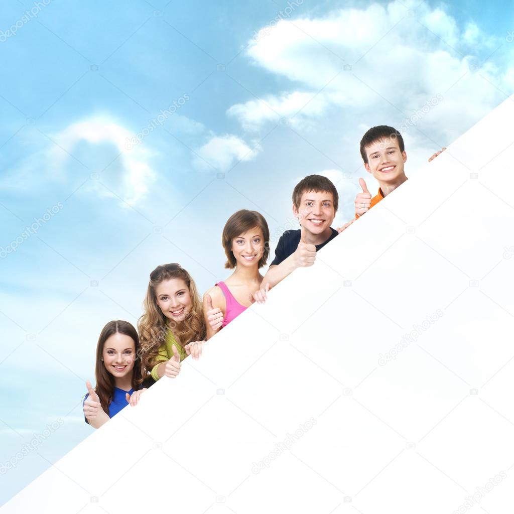 Group of teenagers with a giant, blank