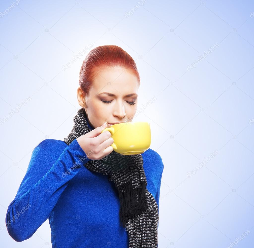 Young woman with the cup of tea