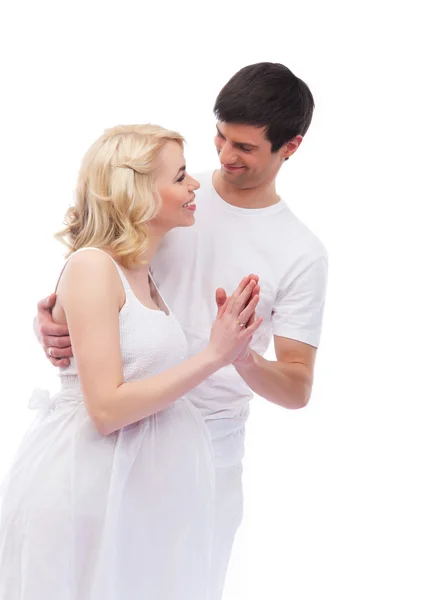 A happy couple: pregnant mother and a father on white — Stock Photo, Image